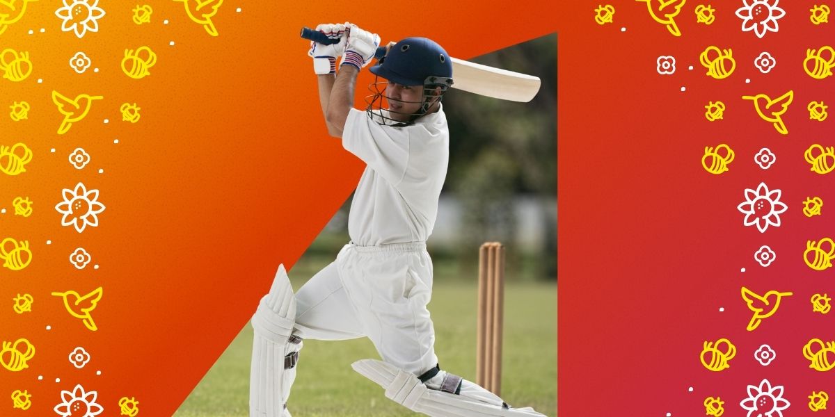 Cricketer in white kit and helmet batting on a pitch, with a decorated orange and red background.