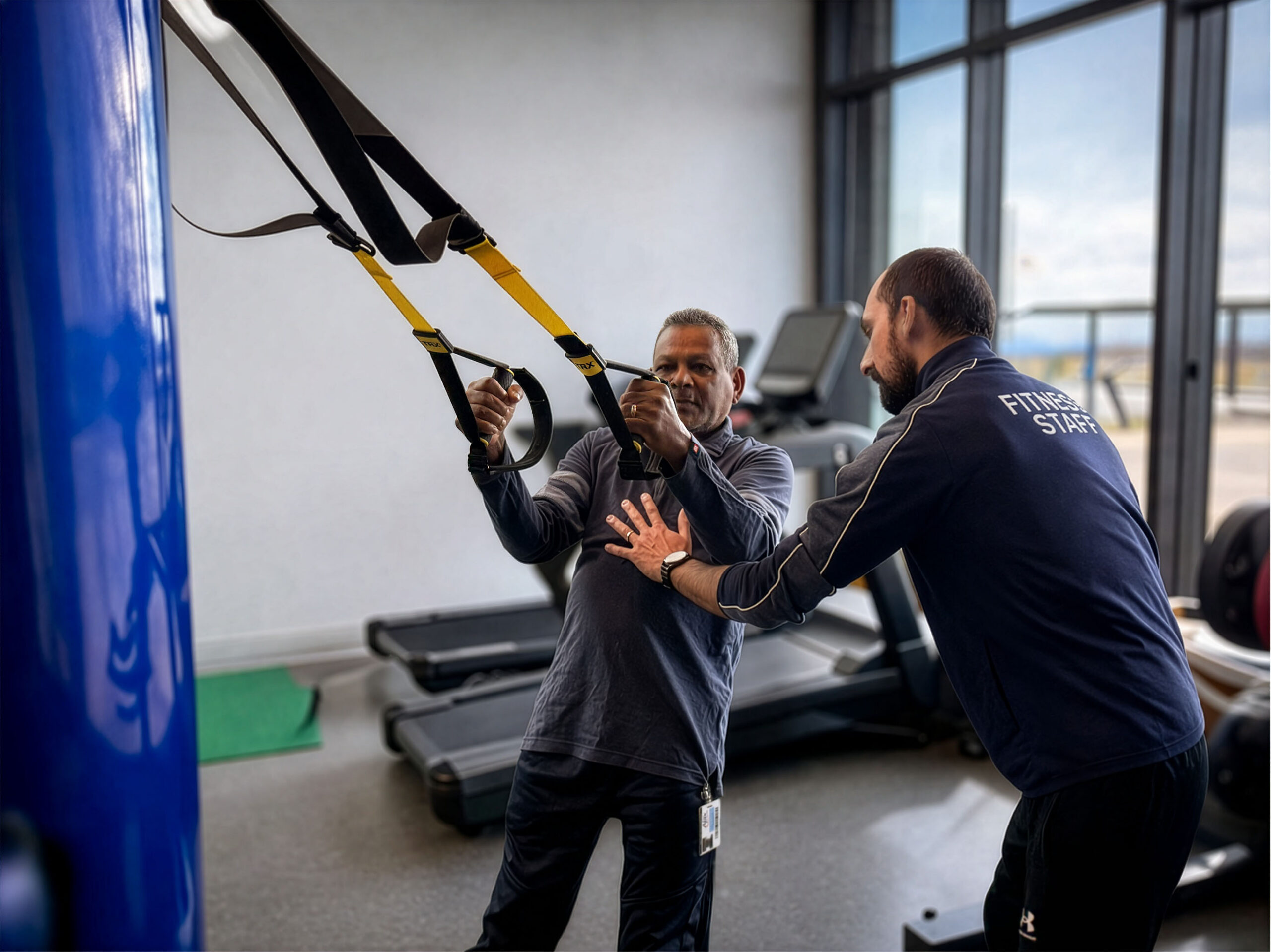 A Fitness & Health Centre professional helps a member in the Core Performance Zone.