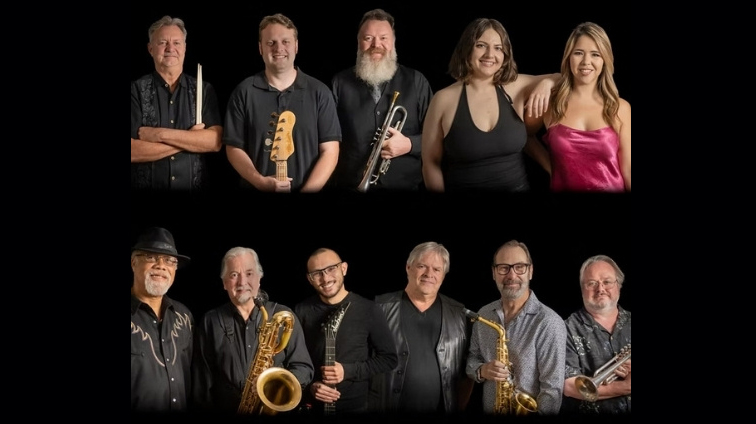 Members of Project Phoenix stand together with instruments.