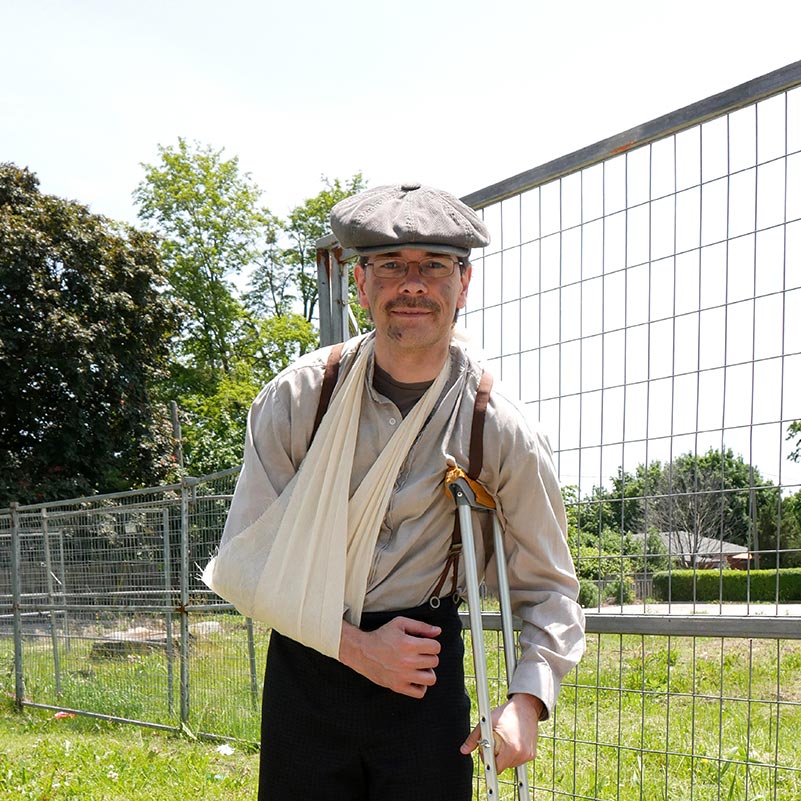 A 'spirit' wears a sling and a cap at Spirit Walk.