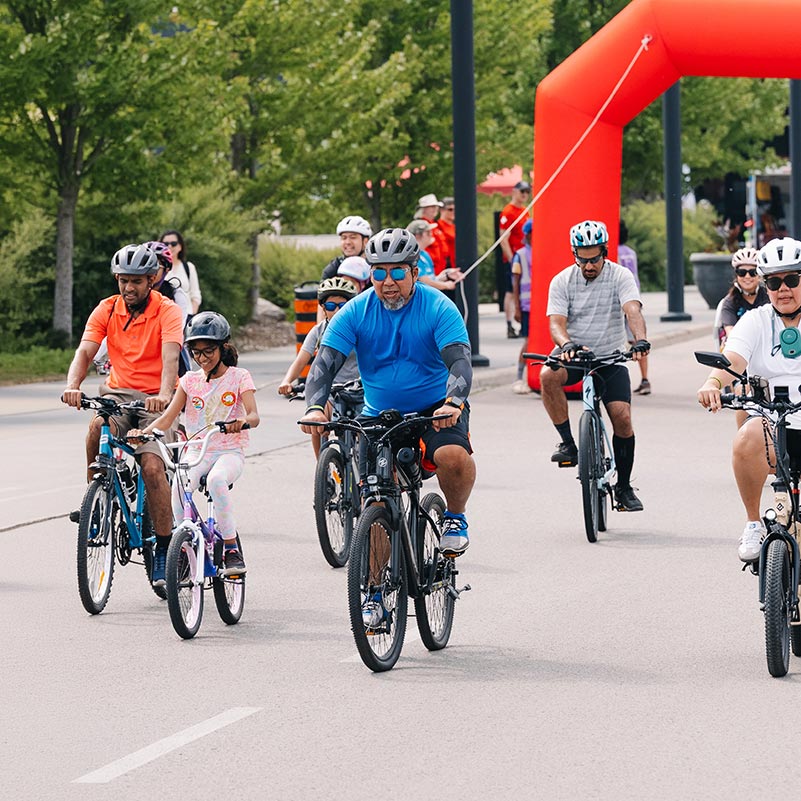 Families ride their bikes together during Trailfest.